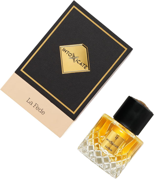 Perfume bottle with packaging featuring 'Intoxicate' brand on a white background