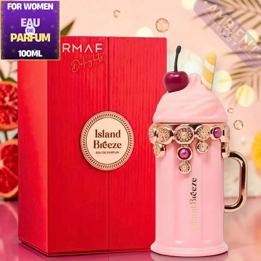 Pink parfait-shaped perfume bottle with 'Island Breeze' branding next to a red box, on a decorative background.