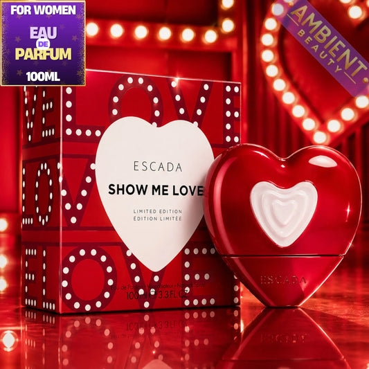 Escada Show Me Love perfume with packaging on a red background