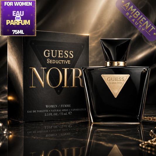 Guess Seductive Noir perfume bottle and packaging on a reflective surface with 'Ambient Beauty' label.