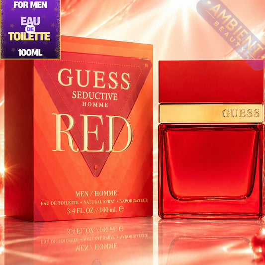 Guess Seductive Homme Red perfume bottle and packaging on a reflective surface with 'Ambient Beauty' label.
