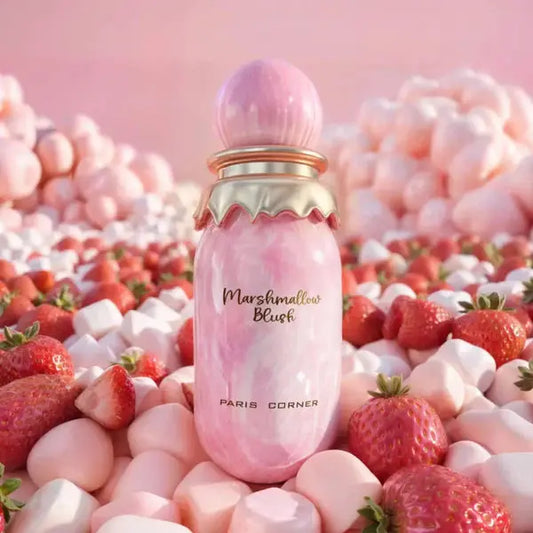Pink perfume bottle labeled 'Marshmallow Blush' surrounded by strawberries and marshmallows on a pink background