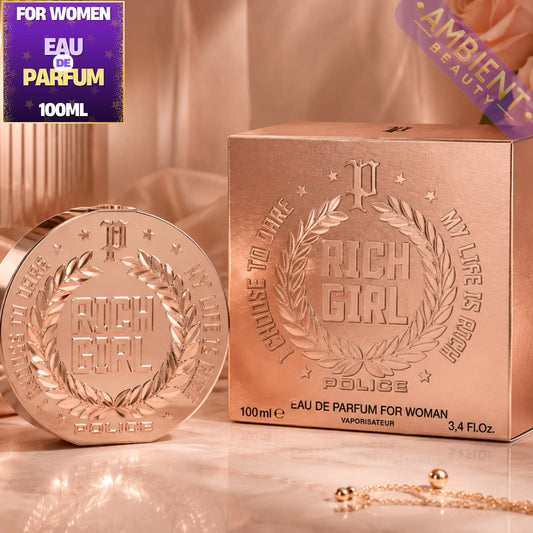 Rose gold 'Rich Girl' Police perfume bottle and packaging on a reflective surface.