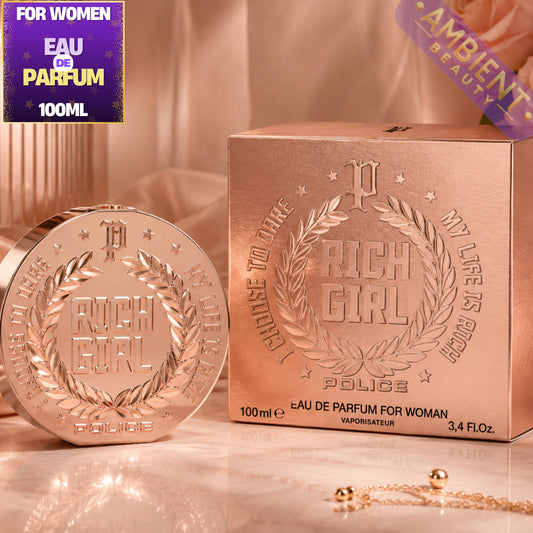 Rose gold 'Rich Girl' Police perfume bottle and packaging on a reflective surface.