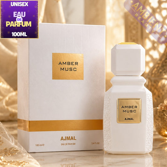 AJMAL Amber Musc perfume bottle and packaging on a reflective surface with decorative background