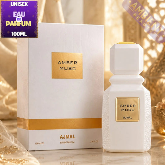 AJMAL Amber Musc perfume bottle and packaging on a reflective surface with decorative background
