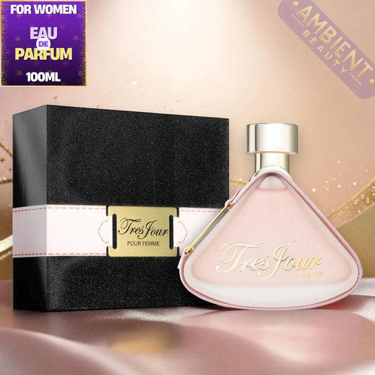 Tres Jour perfume bottle and packaging on a reflective surface with 'Ambient Beauty' branding.