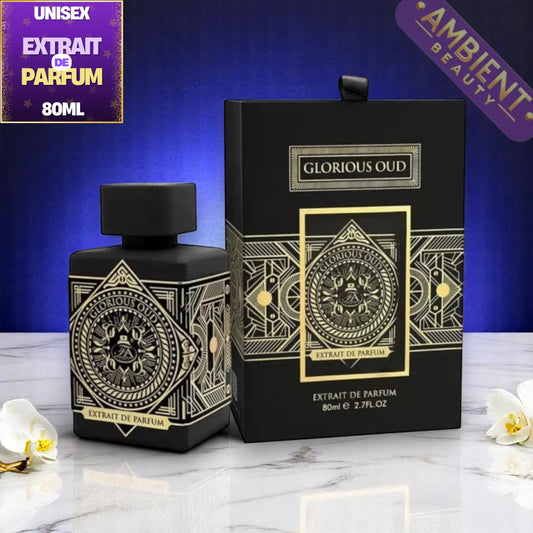 A black rectangular perfume bottle with a matching black box, both decorated with ornate gold geometric and circular emblem designs. The product is labeled 'GLORIOUS OUD' and 'EXTRAIT DE PARFUM'.
