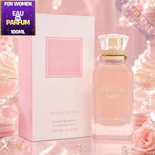 Gulf Orchid Sweet Like Candy perfume bottle and packaging on a pink background with roses.