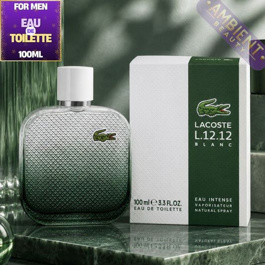 Lacoste L.12.12 Blanc perfume bottle and packaging on a marble surface with greenery in the background.