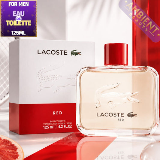 Lacoste Red Eau de Toilette bottle and packaging on a reflective surface with 'Ambient Beauty' label.