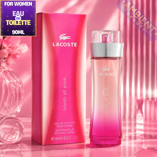 Lacoste women's perfume bottle and packaging on a pink background