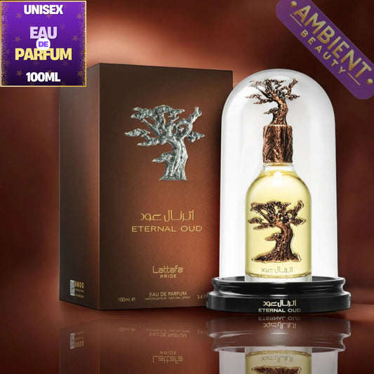 Lattafa ETERNAL OUD Eau de Parfum 100ml bottle under a clear glass dome with a bronze tree cap, shown next to its brown box on a reflective surface. Promotional badges in the corners read 'UNISEX', 'EAU DE PARFUM 100ML', and 'AMBIENT BEAUTY'.