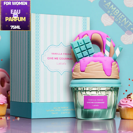 Lattafa Vanilla Freak Perfume bottle shaped like a cake with pink frosting and a chocolate bar, next to a box labeled 'Vanilla Freak' on a colorful background.