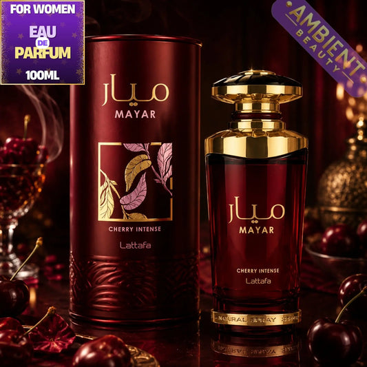 Mayar Cherry Intense perfume bottle and packaging with cherries and a glass of wine in the background.