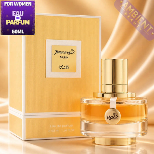 Gold perfume bottle and packaging with 'Junoon' branding on a reflective gold surface.