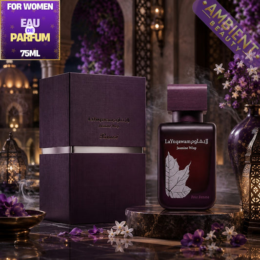 A bottle of LaYuqawam Jasmine Wisp Eau de Parfum for women, shown next to its matching dark purple box. The scene is styled with purple flowers, traditional lanterns, and a warm, atmospheric background.