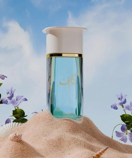 Ahmed Al Maghribi Kaaf bottle with sand and flowers on a beach