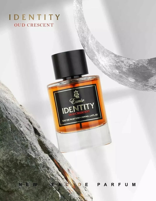 Eau de Parfum bottle with 'Identity Oud Crescent' label on a textured background