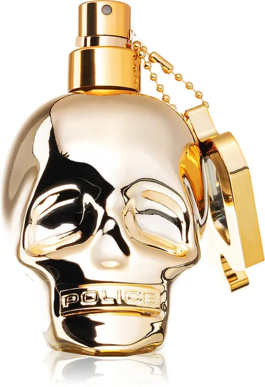 Gold skull-shaped perfume bottle with 'Police' branding on a white background