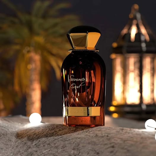 Ahmed Al Maghribi Summer Oud Perfume bottle labeled 'Summit Oud' with a warm glow in the background