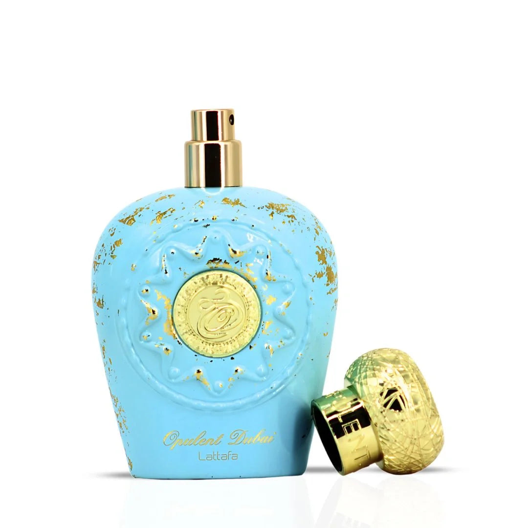 Lattafa Opulent Dubai Blue and gold perfume bottle with a gold cap on a white background