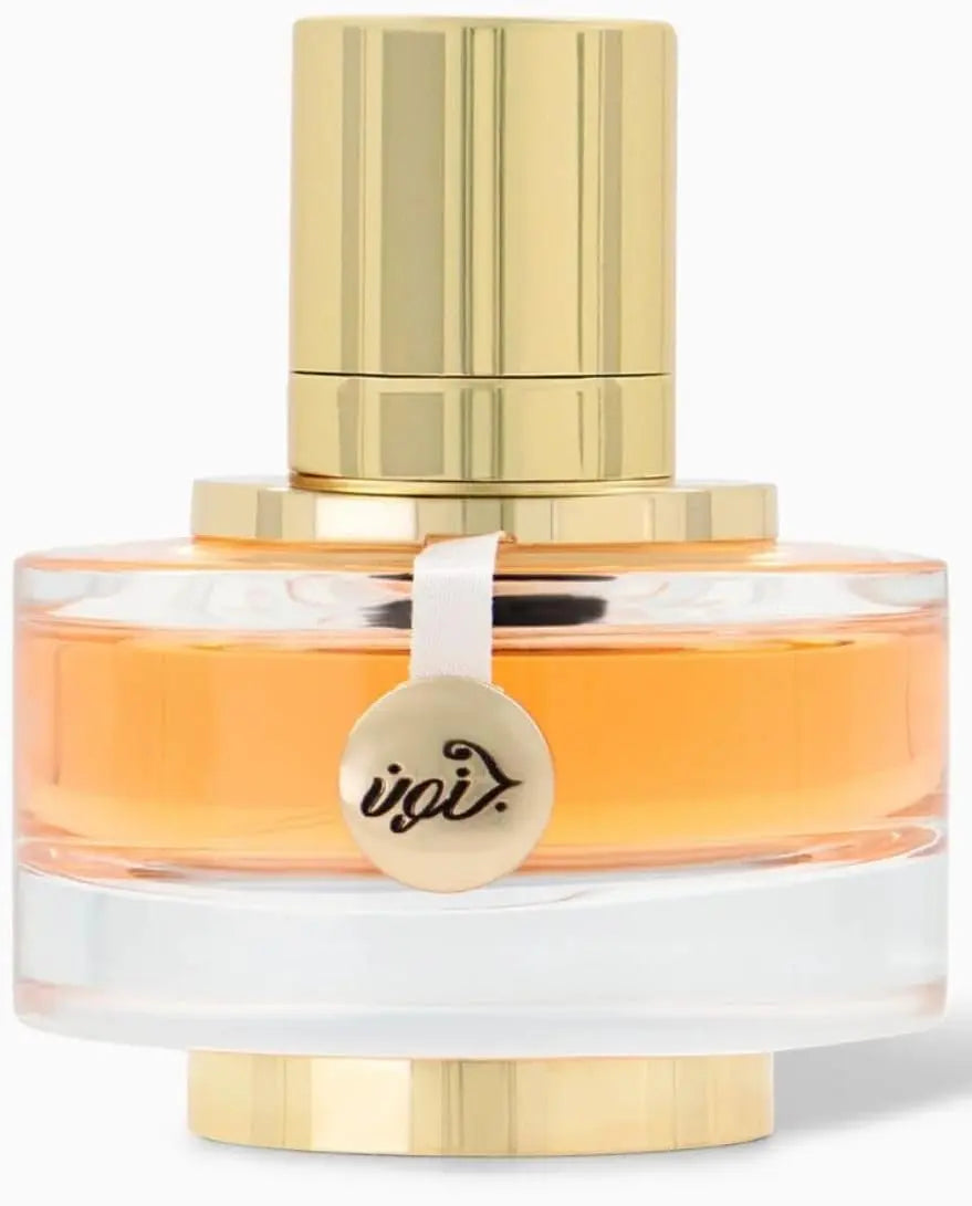 Perfume bottle with gold cap and clear body on a white background