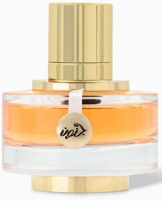 Perfume bottle with gold cap and clear body on a white background