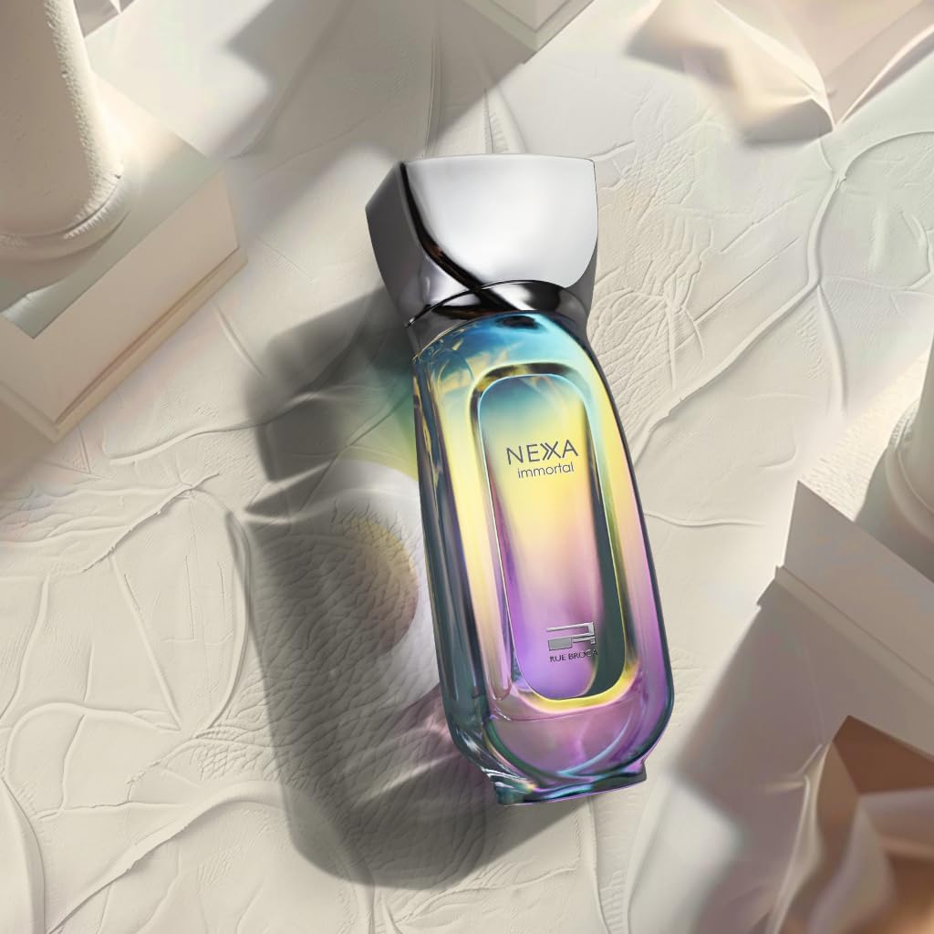 Rue Broca Nexa Immortal bottle on a textured surface with soft lighting