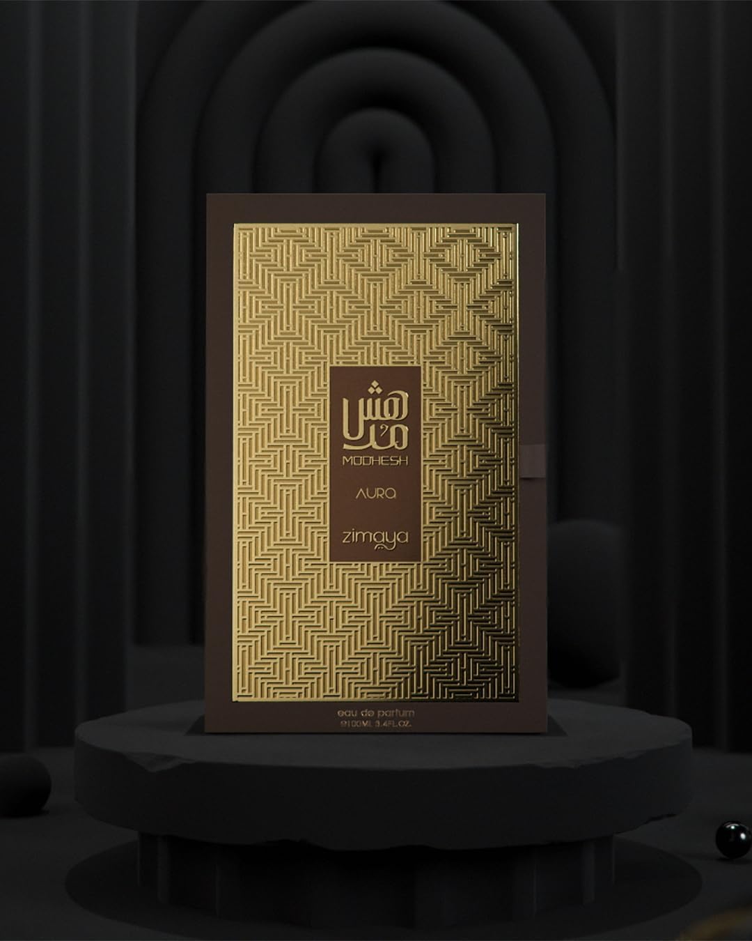 Modhesh Aura Zimaya perfume packaging on a dark background