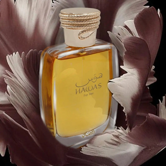 Perfume bottle labeled 'Hawas' surrounded by flowers