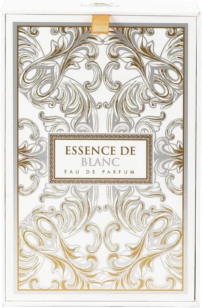Decorative packaging for 'Essence de Blanc' eau de parfum with intricate gold patterns on a white background.
