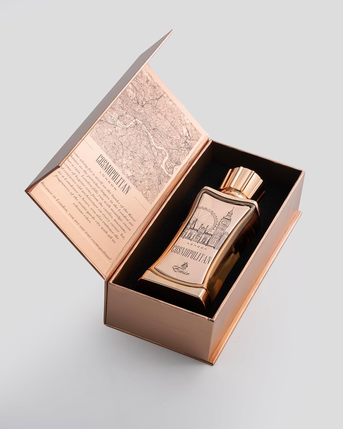 Emir Cosmopolitan London Rose gold bottle with decorative design in an open box on a light gray background