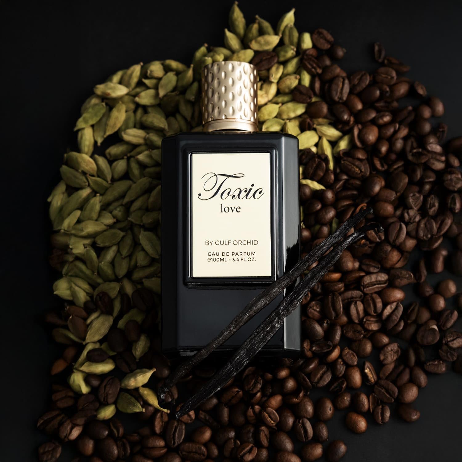 Perfume bottle labeled 'Toxic Love' surrounded by coffee beans and cardamom pods on a dark background