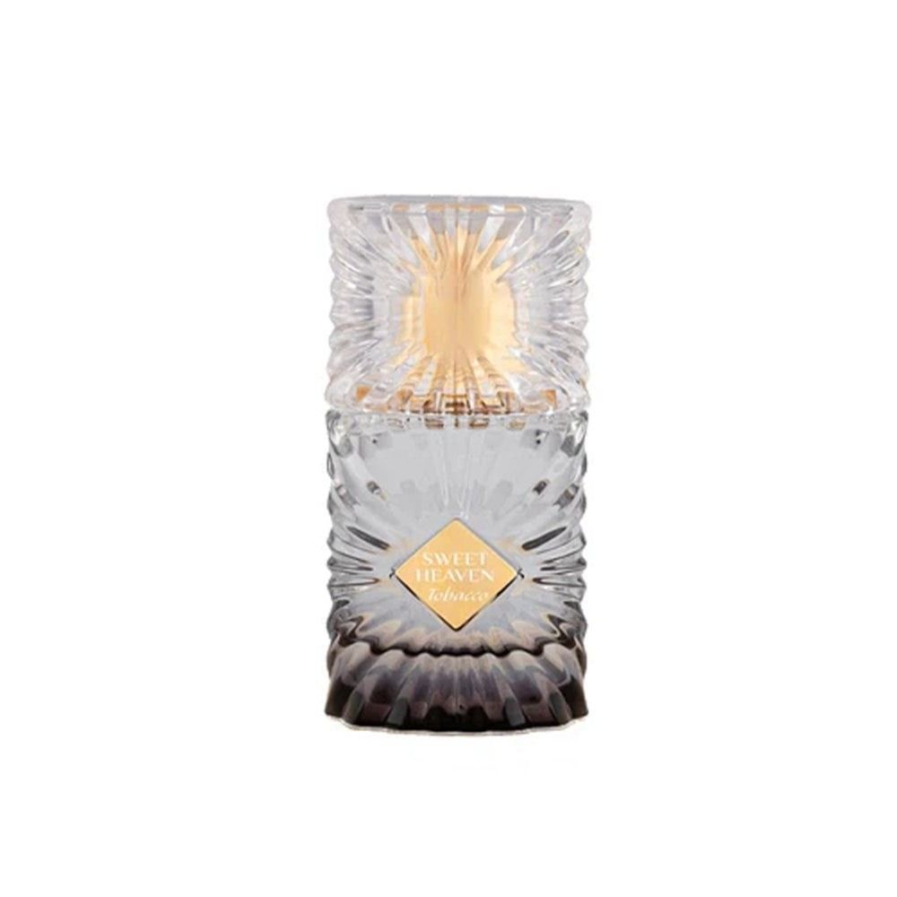 Decorative candle with a textured glass holder and gold accents on a white background