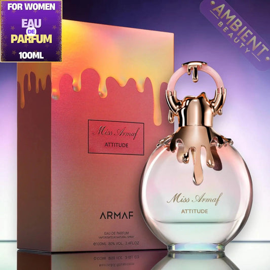 Armaf Miss Armaf Attitude perfume bottle and packaging on a reflective surface with a colorful background.