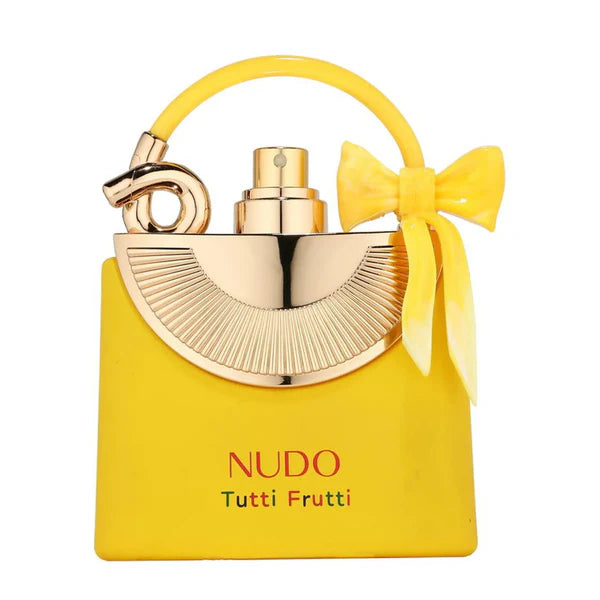 Yellow and gold Nudo Tutti Frutti perfume bottle with a bow on a white background