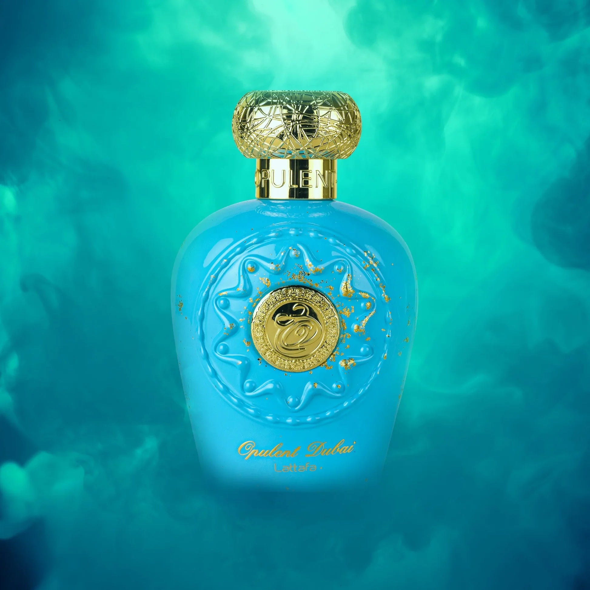 Lattafa Opulent Dubai Blue perfume bottle with gold cap and decorative elements on a teal background