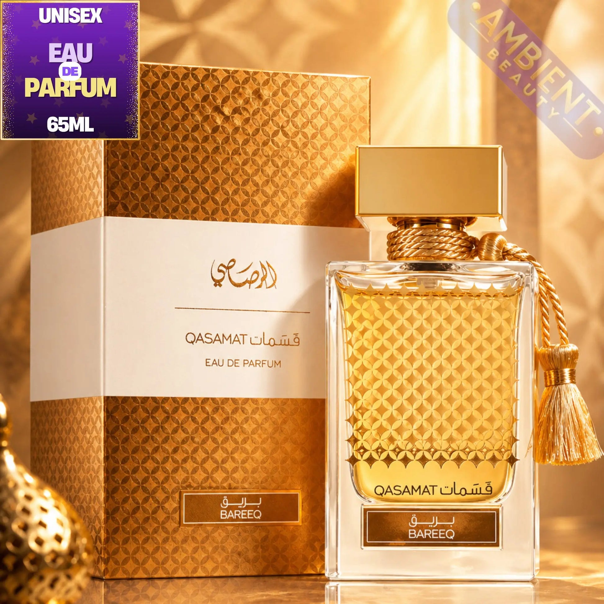 Qasamat Eau de Parfum bottle and packaging with 'Ambient Beauty' label on a gold background