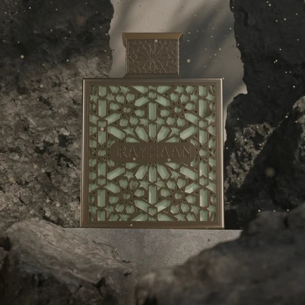 Decorative box with intricate patterns and 'RAYHAAN' branding on a textured surface.