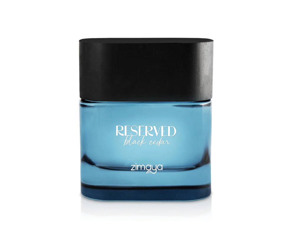 Blue glass bottle with black cap labeled 'Reserved' by zimaya on a white background