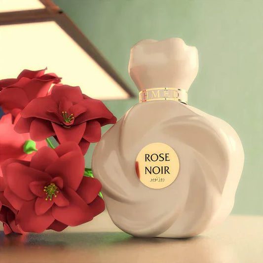 Ahmed Al Maghribi Rose Noir Perfume bottle labeled 'Rose Noir' next to red flowers on a light background