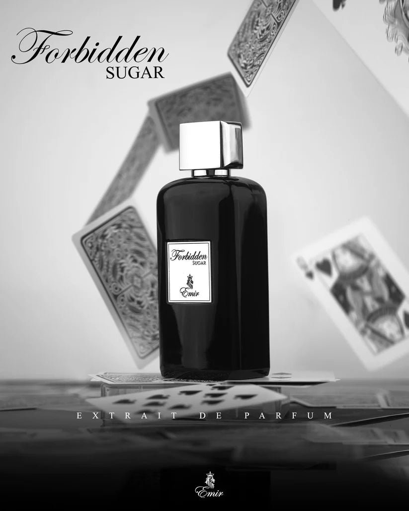 Black perfume bottle labeled 'Forbidden Sugar' on playing cards with a white background