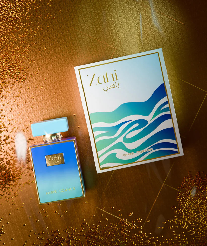 Paris Corner Zahi perfume bottle and packaging on a textured gold surface