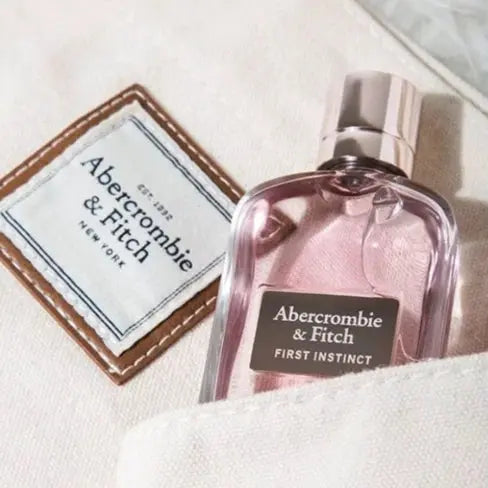 Abercrombie & Fitch perfume bottle on a textured surface