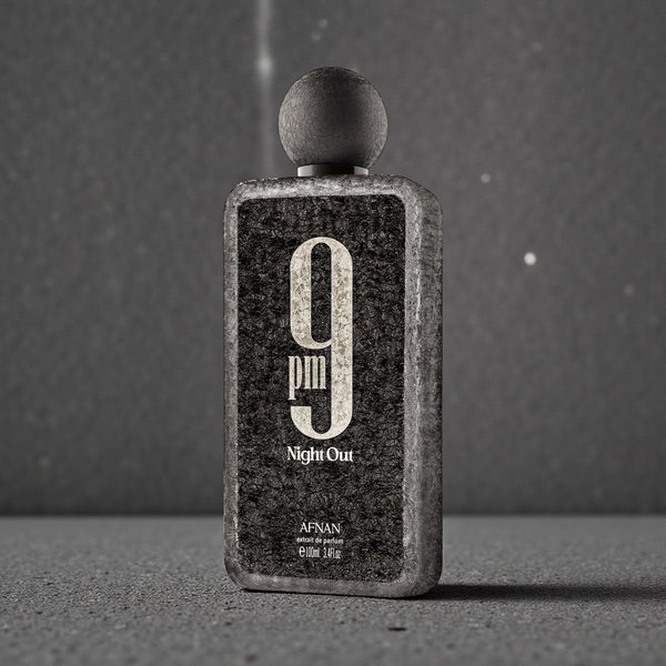 Perfume bottle labeled '9pm Night Out' by Afnan on a gray background