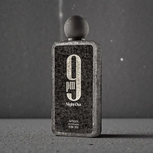 Perfume bottle labeled '9pm Night Out' by Afnan on a gray background