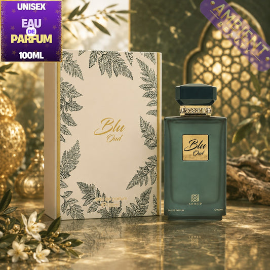 Blu Oud perfume bottle and packaging with decorative elements on a reflective surface.