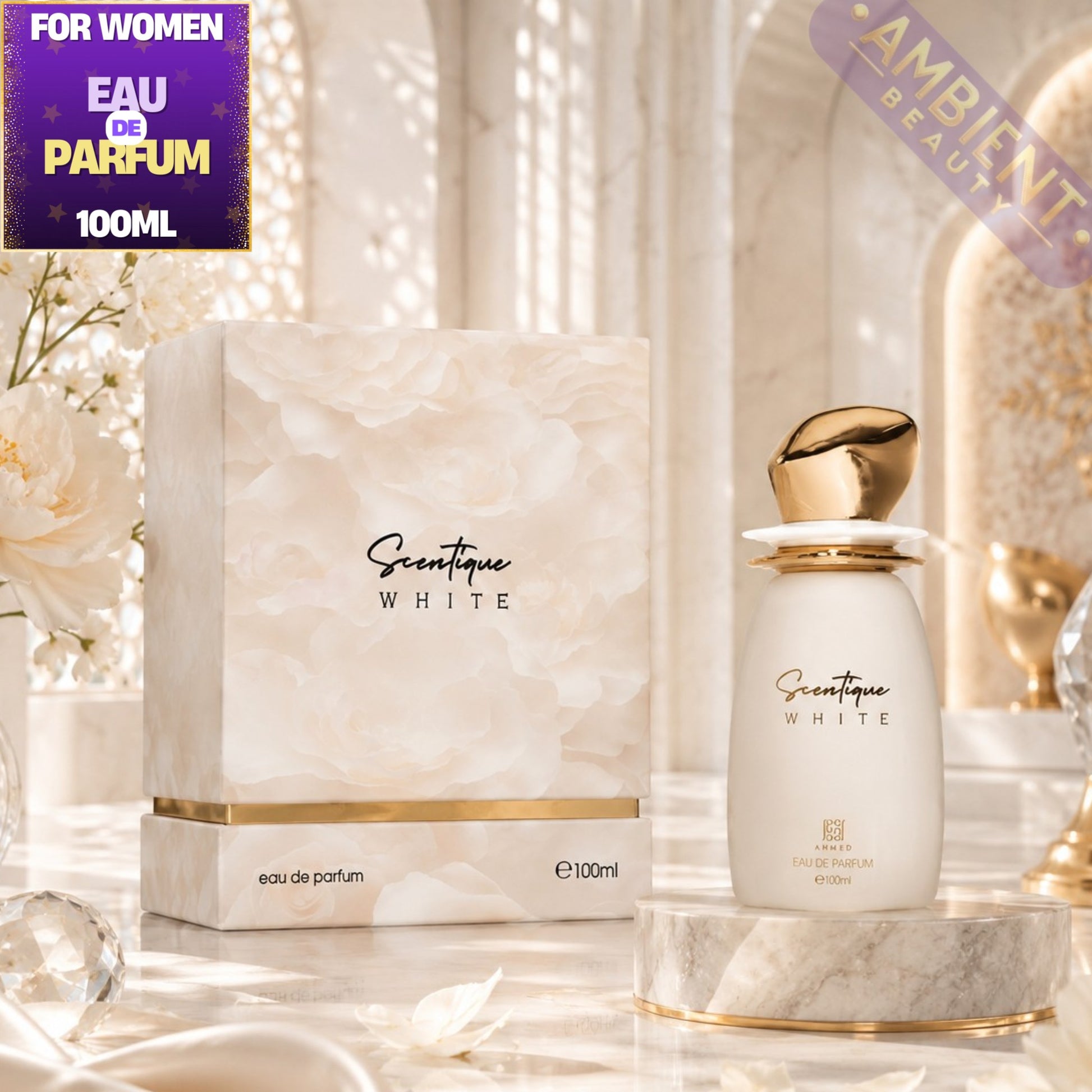 Scentique White Eau de Parfum 100ml bottle with its matching marble-patterned box, displayed on a marble pedestal with decorative flowers and crystals in a bright, elegant setting.