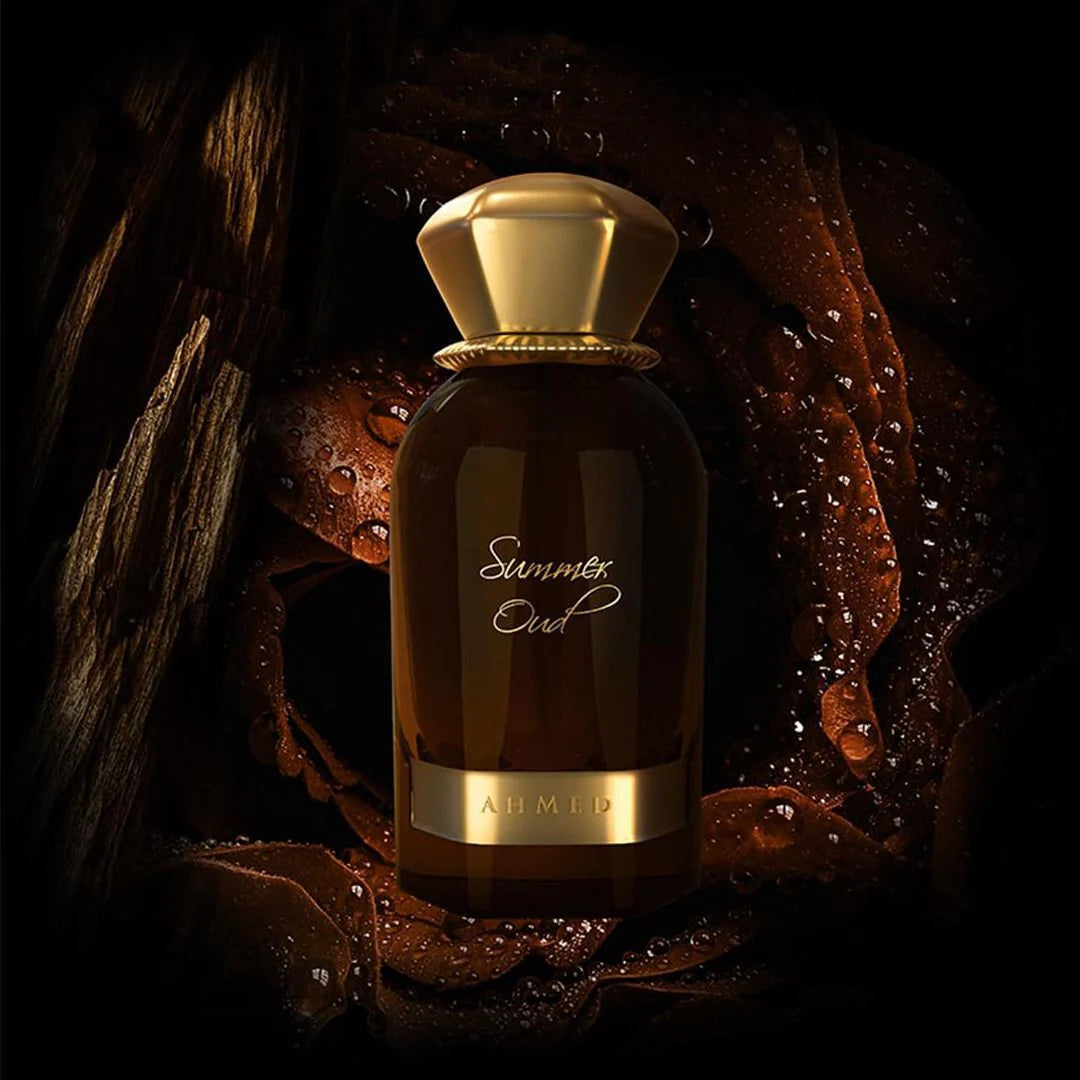 Ahmed Al Maghribi Summer Oud Perfume bottle with gold cap and label on a dark background